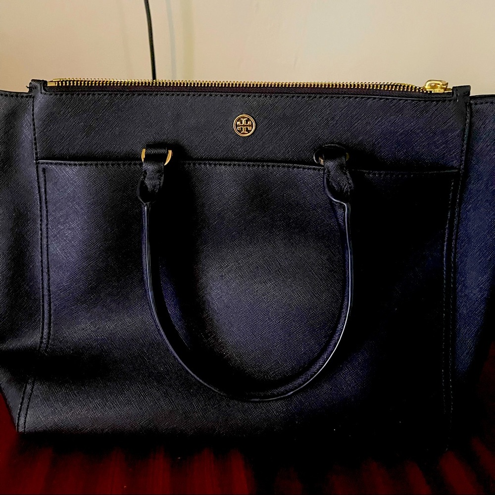This an authentic black Tory Burch tote.